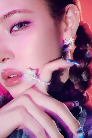 MAI, close up, a hand at her cheek